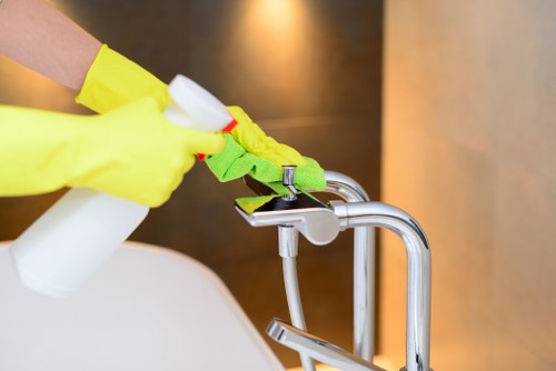 Professional cleaner vacuuming carpets in a Harrow office