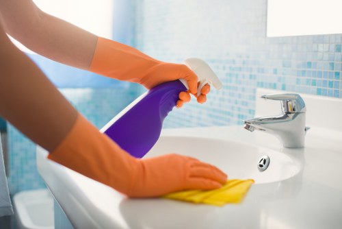 Commercial cleaner working in a Harrow office reception area