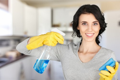 Technician treating a rug stain with specialist cleaning tools